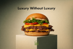 A burger sits on a stand in focus. Above it says "Luxury without Luxury"